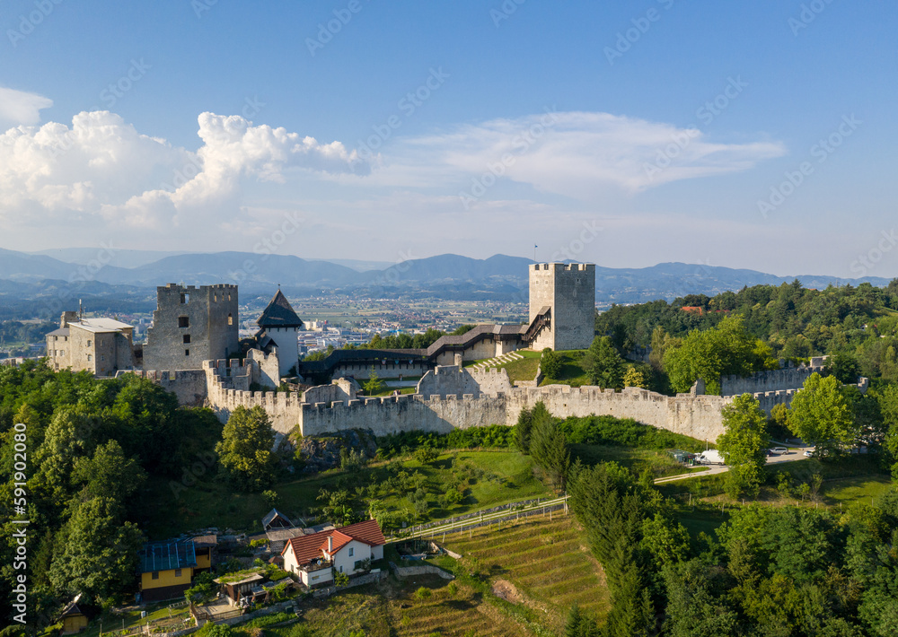 Obraz premium Celje Castle is a castle ruin in Celje, Slovenia, formerly the seat of the Counts of Celje. It stands on three hills to the southeast of Celje, where the river Savinja meanders into the Lasko valley