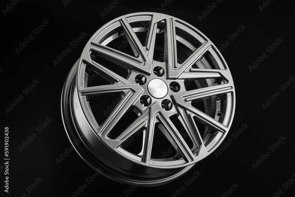 Grey multi-spoke alloy wheel on black background