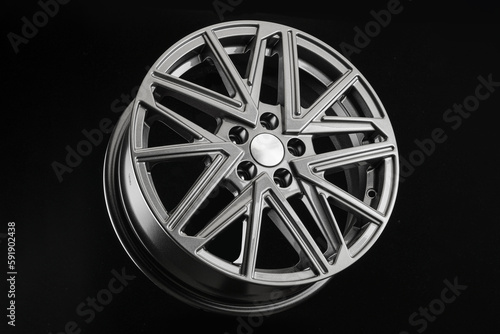 Grey multi-spoke alloy wheel on black background