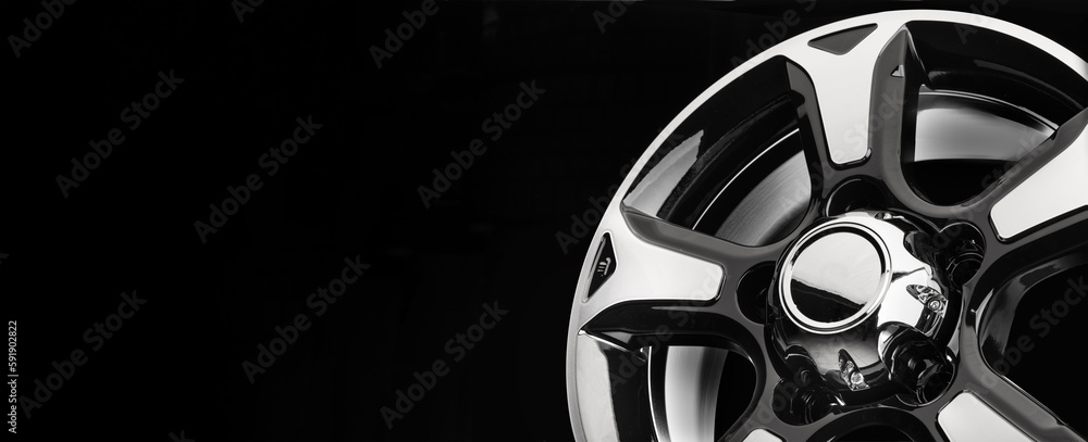 Beautiful powerful alloy wheels for SUVs close-up on a black background, copy space panoramic