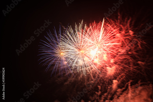 Colorful firework with bokeh background. New Year celebration  Abstract holiday background. Fireworks at Night. Abstract background for celebration