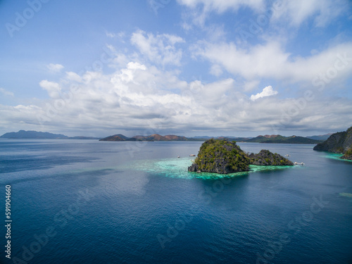 Malwawey Coral Garden in Coron, Palawan, Philippines. Mountain and Sea in background. Tour A. © Mindaugas Dulinskas