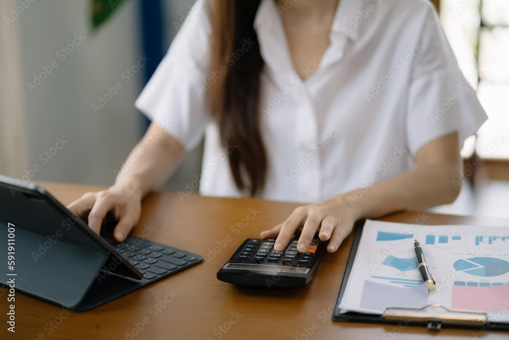 women doing finances and calculate on desk about cost at home office. women doing finances and calculate on desk about cost at home office.