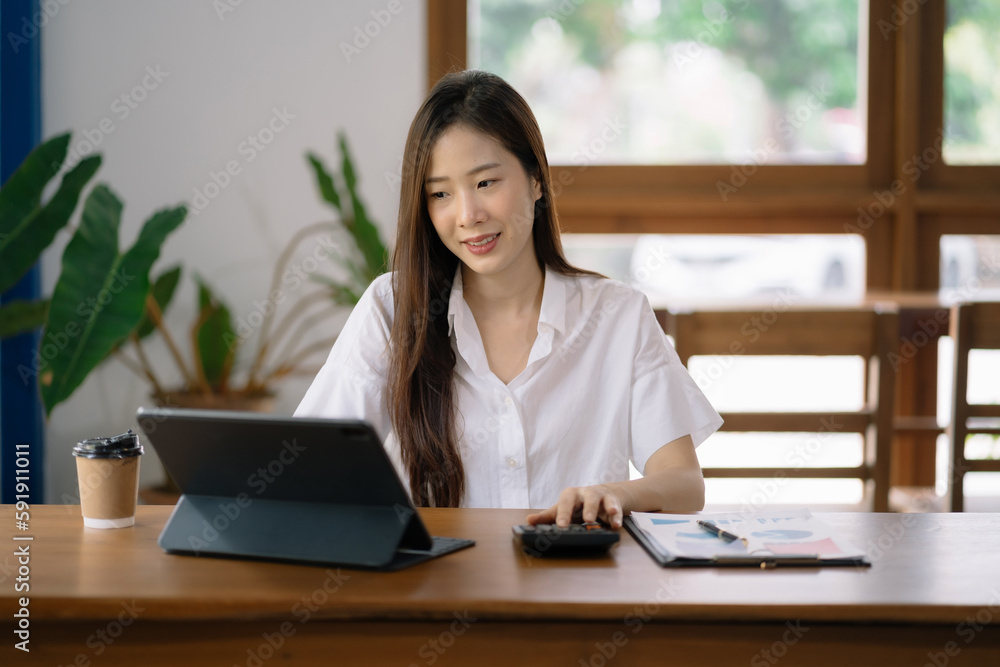 women doing finances and calculate on desk about cost at home office. women doing finances and calculate on desk about cost at home office.