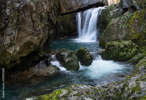 Waterfall with mossy rocks in forest, Svrakava waterfall near Banja Luka