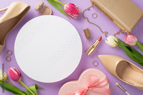 Elegant Mother's day concept. Top view of high-heels, handbag, present box, tulips, lipstick, makeup brush, earrings on purple background. Empty circle for text or advert