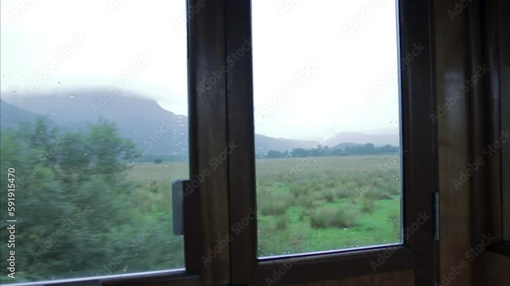 looking out of a steam train carriage out on misty mountains looking out of a steam train carriage out on misty mountains