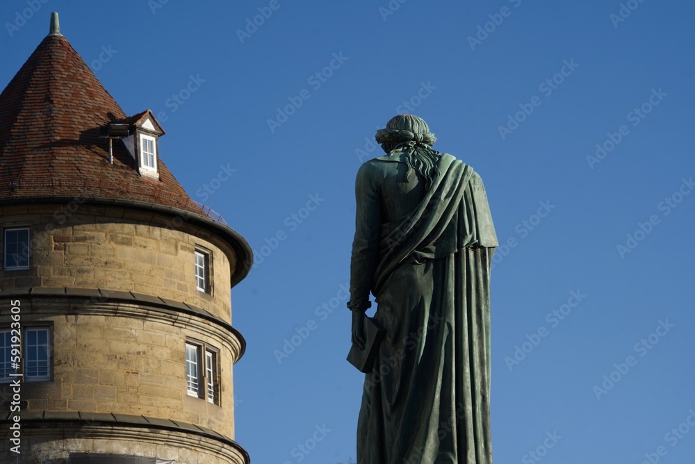 Fototapeta premium Tower of the old castle and Schiller monument in the rear view. Stuttgart - Germany