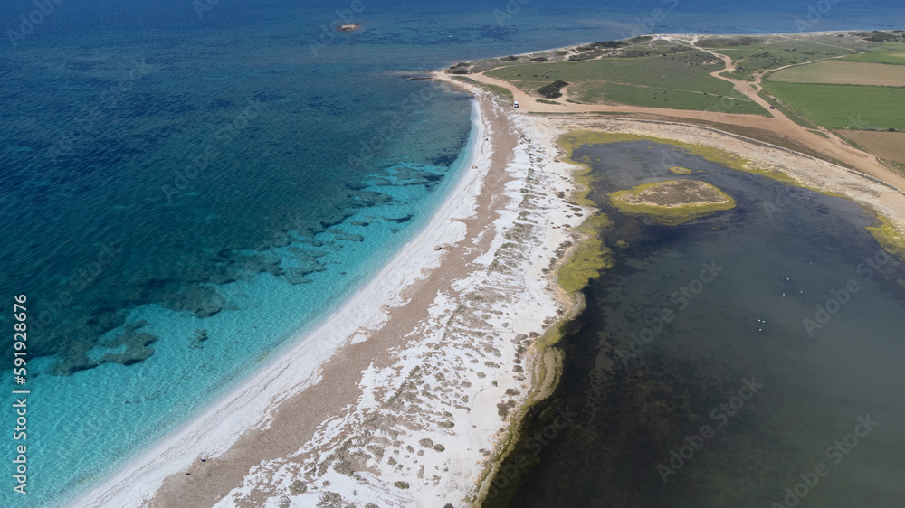 aerial view of the crystalline waters of the sea of ​​is arutas and mari ermi beach in sardinia

