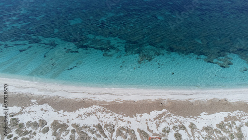 aerial view of the crystalline waters of the sea of ​​is arutas and mari ermi beach in sardinia 