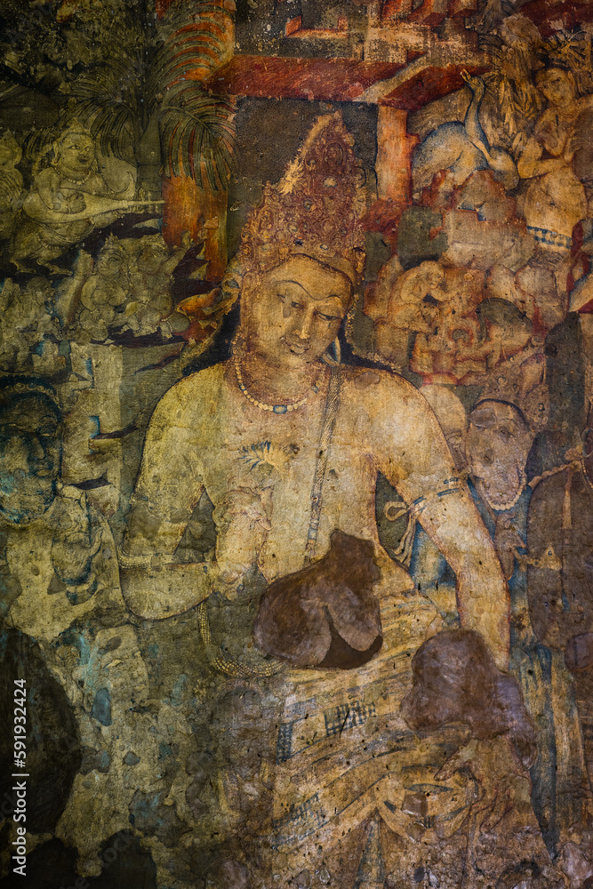 The 5th-century Bodhisattva Padmapani painting depicting the Buddha holding a lotus flower at Ajanta caves, Maharashtra, India.