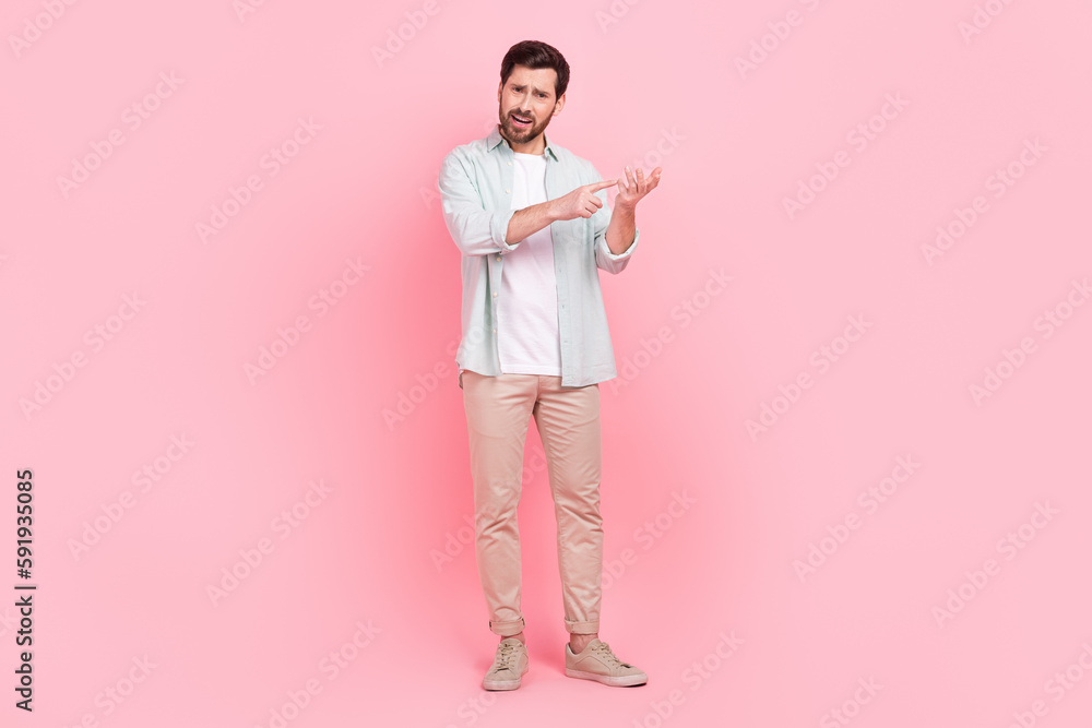 Full length photo of nice young male counting fingers match explain irritated wear trendy blue garment isolated on pink color background Full length photo of nice young male counting fingers match explain irritated wear trendy blue garment isolated on pink color background