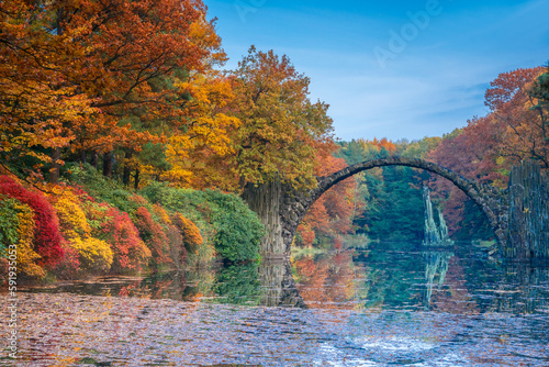 Arch Bridge in Kromlau, Saxony, Germany. Colorful autumn in Germany. Rakotz bridge in Kromlau photo