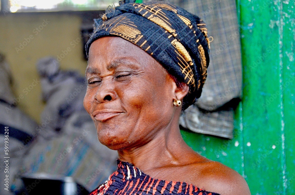 Portrait of a humorous market woman at Makola Market in Accra, Ghana