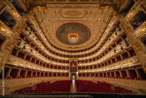 Parma, Italy - April 10, 2023: panoramic view of the historic Teatro Regio, formerly known as New Ducal Theatre, in Emilia-Romagna, Italy. 
StructuStructure is built in wood and was completed in 1618.