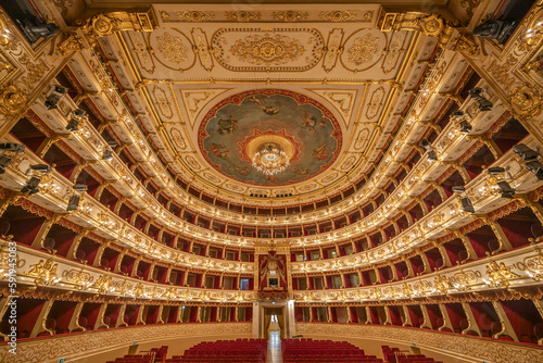 Parma, Italy - April 10, 2023: panoramic view of the historic Teatro Regio, formerly known as New Ducal Theatre, in Emilia-Romagna, Italy. 
StructuStructure is built in wood and was completed in 1618.