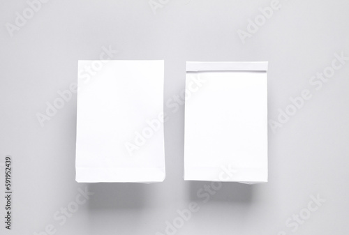White food packs on gray background. Template for design