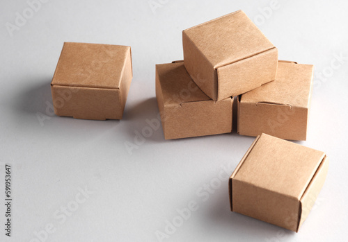 Parcel cardboard craft boxes on a gray background