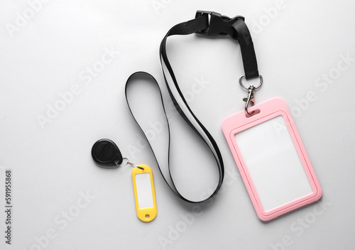 Id card and Plastic tag with magnetic key on gray background
