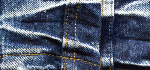 Jeans fabric texture. High quality stock photo. The connection of the fibers of the fabric.