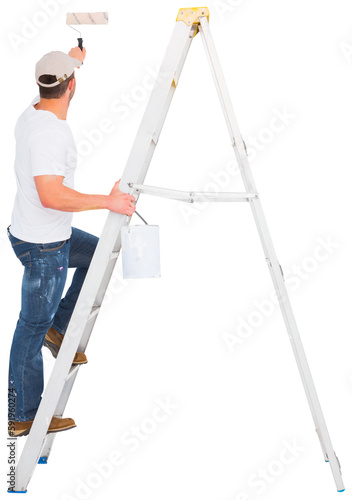 Handyman climbing ladder while using paint roller 