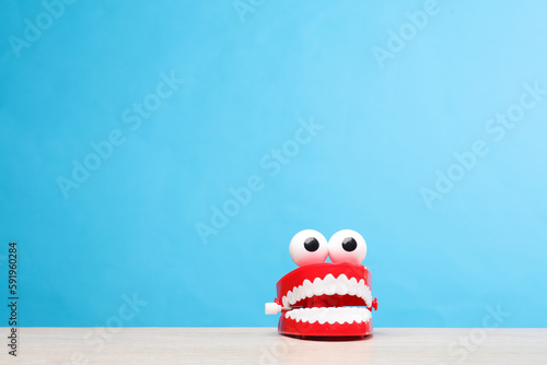 Joke jaw on table, blue background