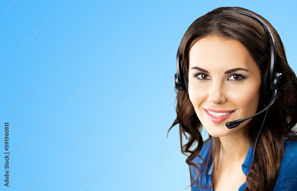 Contact call center. Studio portrait image of smiling female support phone operator in headset, isolated on sky blue background. Customer service help consulting caller.