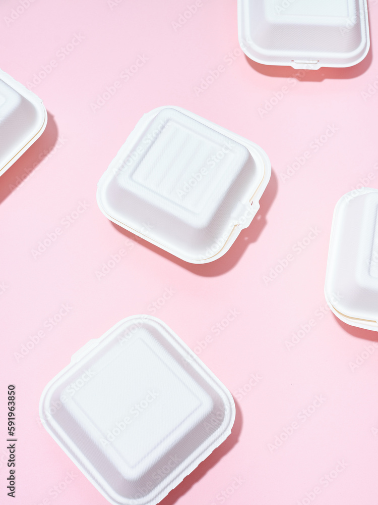 Ecological food delivery packaging. Burger takeaway boxes on green and ...