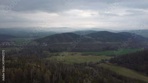 Aerial shot of scenic wild nature. Forests, fields, meadows. mountains in the distance in a haze
