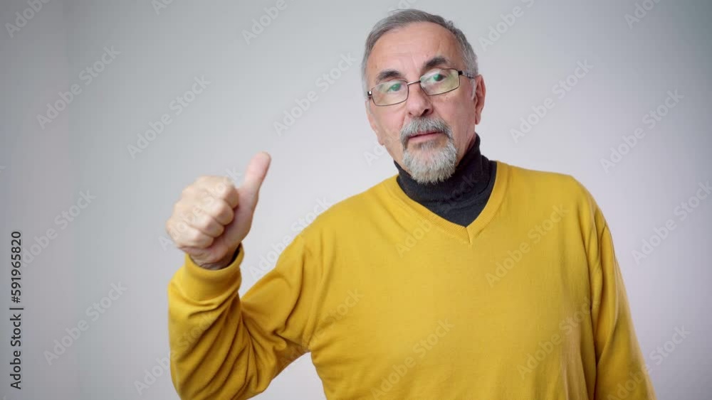 Happy senior handsome man showing thumbs up Happy senior handsome man showing thumbs up