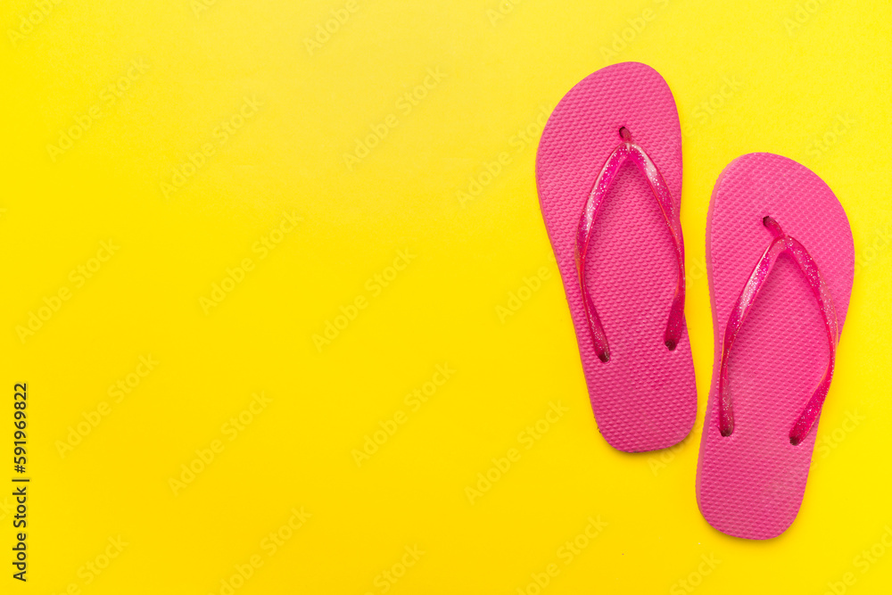 Bright flip flops on color background, top view Bright flip flops on color background, top view