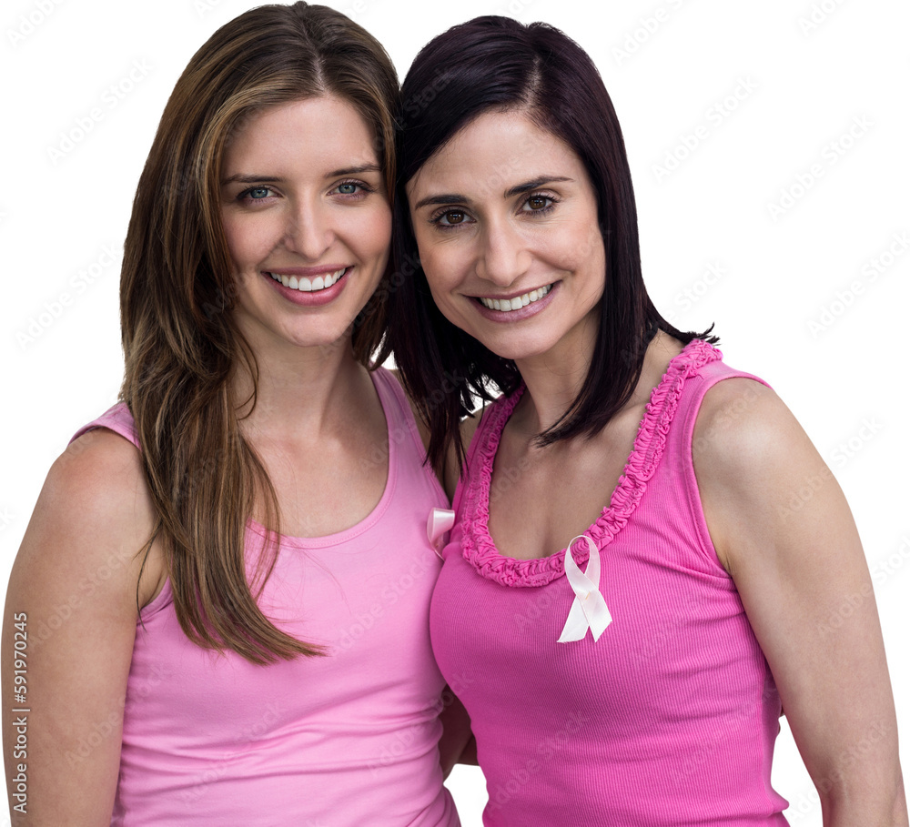 Smiling women in pink outfits posing for breast cancer awareness Smiling women in pink outfits posing for breast cancer awareness