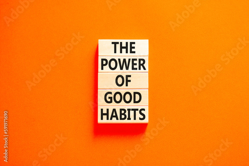 The power of good habits symbol. Concept words The power of good habits on wooden block. Beautiful orange table orange background. Business the power of good habits concept. Copy space