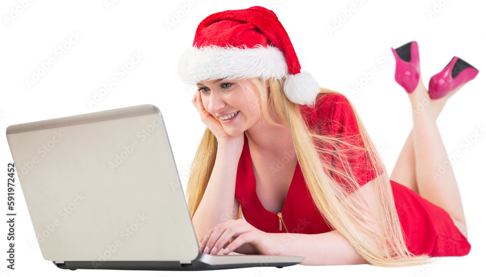 Festive blonde using a laptop Festive blonde using a laptop
