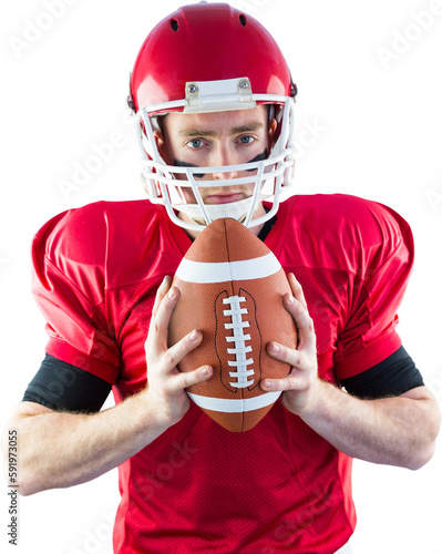 Portrait of focused american football player holding football