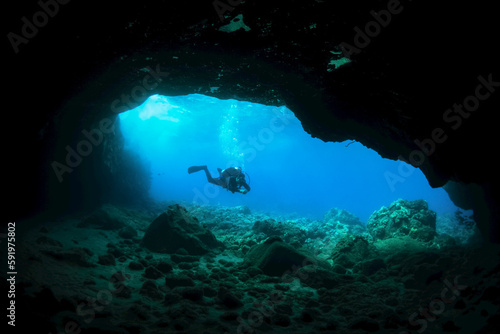 Silhouette of a scuba diver in a cave; Makena, Maui, Hawaii, United States of America photo
