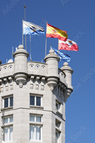 Octagonal tower and flags at Magdalena Palace, a 20th century palace in Spain; Santander, Cantabria, Spain photo