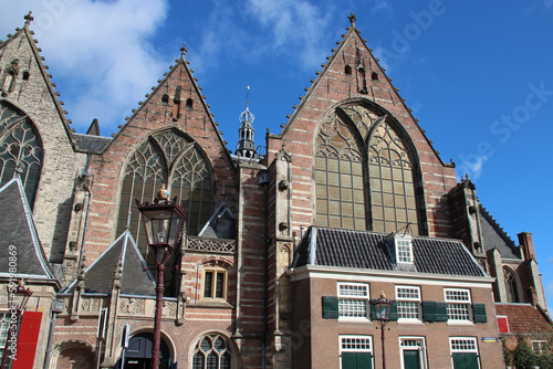old church (oude kerk) and houses in amsterdam (the netherlands)  photo