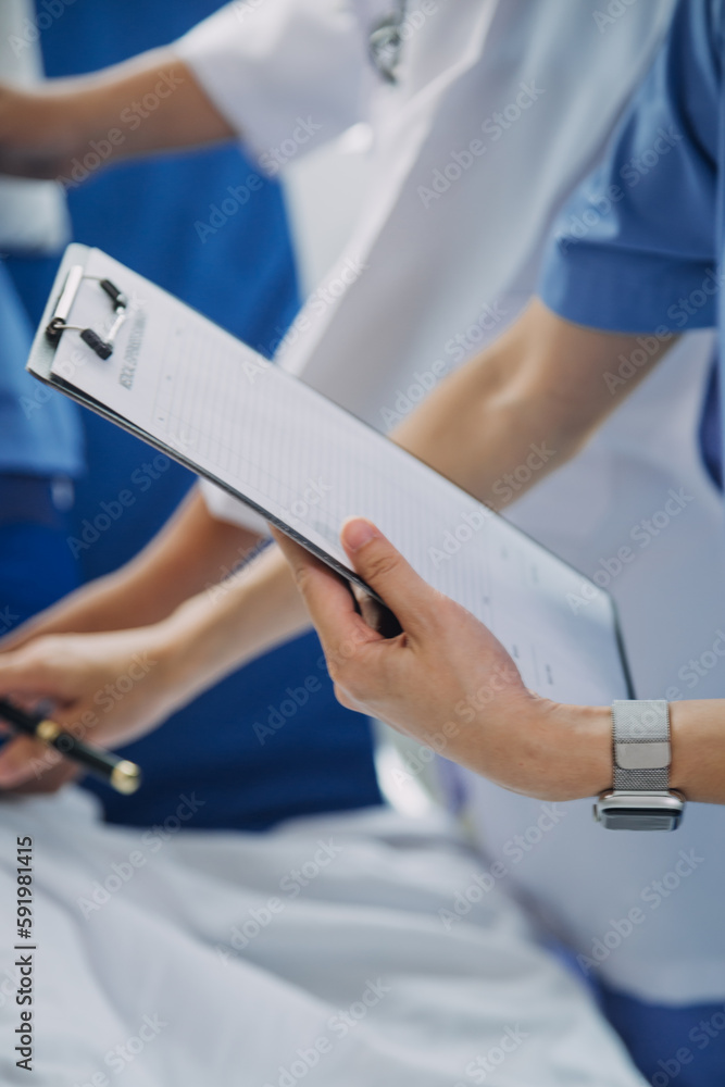 Injured patient showing doctor broken wrist and arm with bandage in hospital office or emergency room. Sprain, stress fracture or repetitive strain injury in hand. Nurse helping customer. First aid. Injured patient showing doctor broken wrist and arm with bandage in hospital office or emergency room. Sprain, stress fracture or repetitive strain injury in hand. Nurse helping customer. First aid.