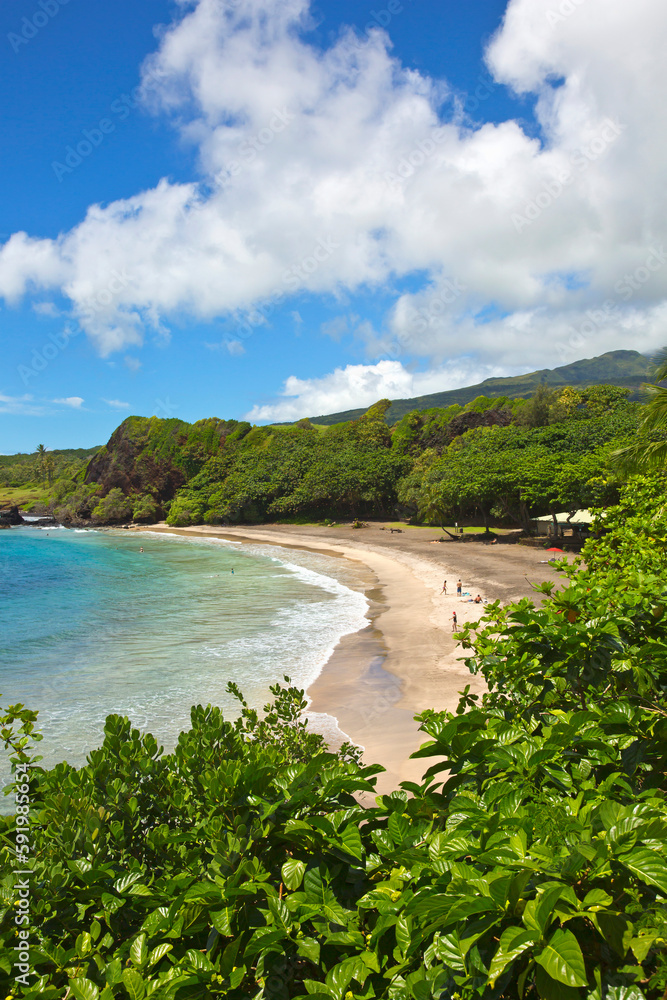 Beautiful Hamoa Beach along the Maui coastline; Hana, Maui, Hawaii, United States of America Beautiful Hamoa Beach along the Maui coastline; Hana, Maui, Hawaii, United States of America