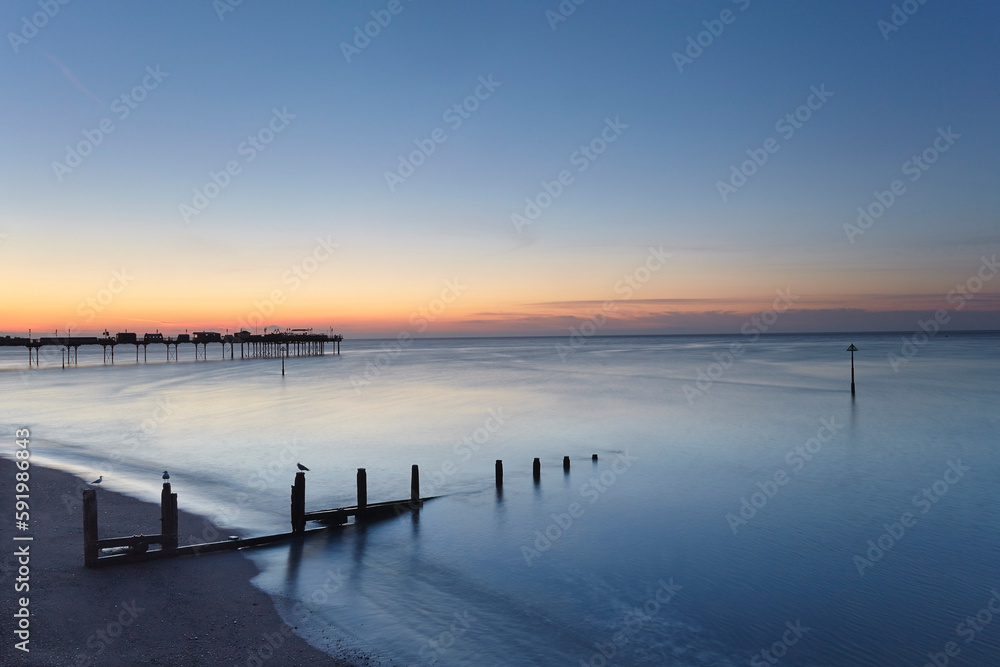 Dawn over Teignmouth Beach; Teignmouth, Devon, England Dawn over Teignmouth Beach; Teignmouth, Devon, England