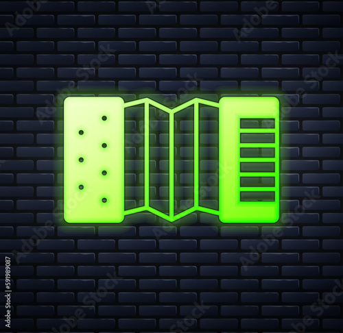 Glowing neon Musical instrument accordion icon isolated on brick wall background. Classical bayan, harmonic. Vector