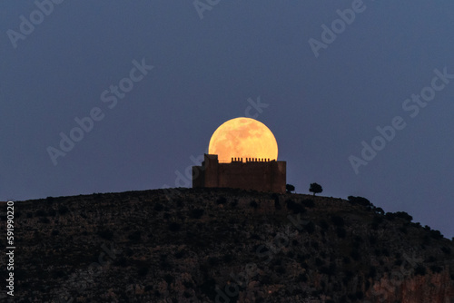 The full moon over the castle of Montgri photo
