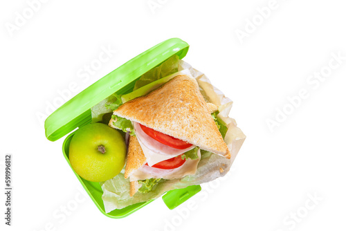 school snack - sandwich in the plastic box on a table, selective focus