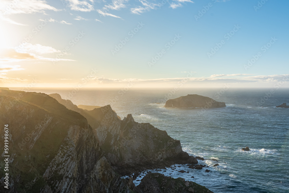 Panoramic view of the cliffs of Asturias by the Cantabrian Sea in northern Spain at sunset.