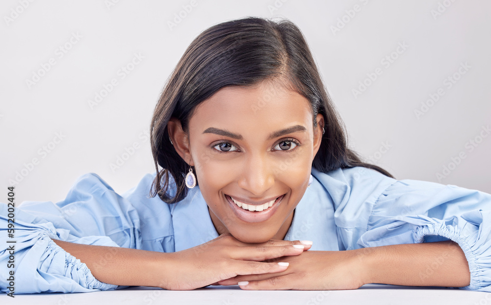 Face, smile and portrait of woman relax feeling happy, confident and excited isolated in a studio white background. Employee, head and Indian female worker proud, happiness and confidence