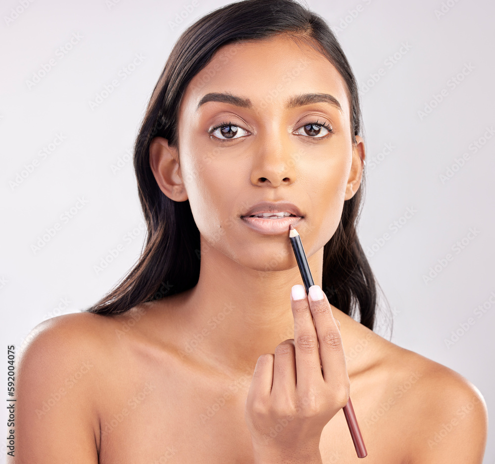 Woman, face and portrait with makeup and lip liner, beauty and cosmetic product with glow on studio background. Indian female, cosmetics pencil for lips and lipstick with healthy skin and cosmetology Woman, face and portrait with makeup and lip liner, beauty and cosmetic product with glow on studio background. Indian female, cosmetics pencil for lips and lipstick with healthy skin and cosmetology