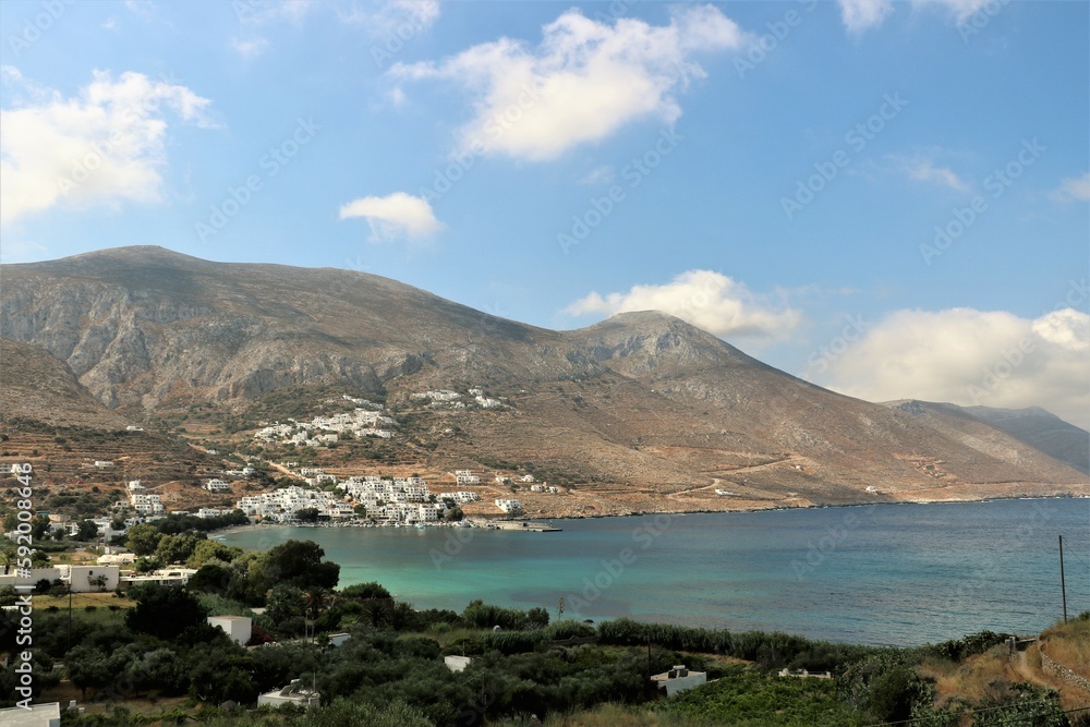 view of Aegiali village with the surrounding mountains and the bay on the island of Amorgos, Greece 