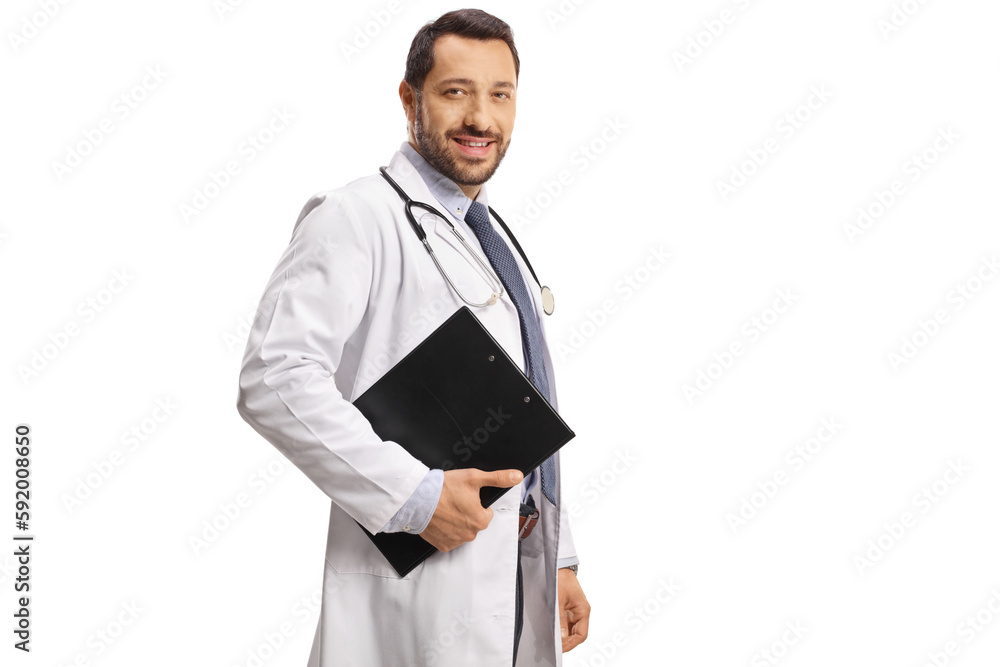 Young male doctor smiling and holding a clipboard Young male doctor smiling and holding a clipboard