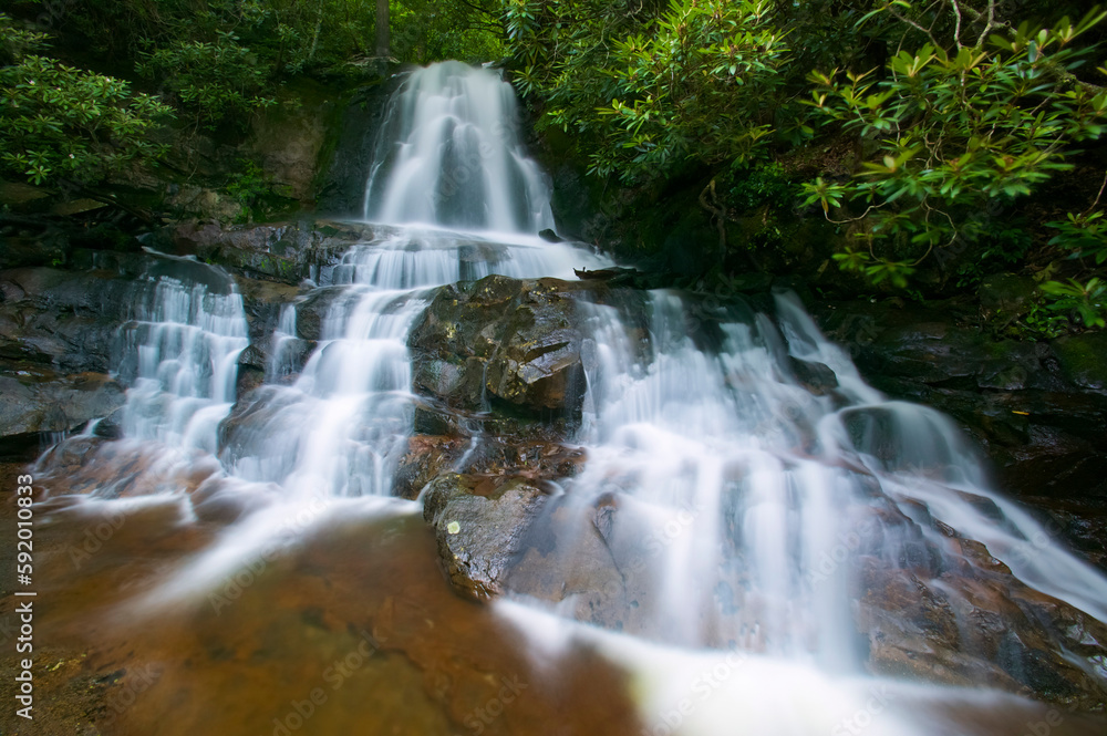Laurel Falls waterfall spilling over rocks in Great Smoky Mountains National Park, Tennessee, USA; Tennessee, United States of America Laurel Falls waterfall spilling over rocks in Great Smoky Mountains National Park, Tennessee, USA; Tennessee, United States of America